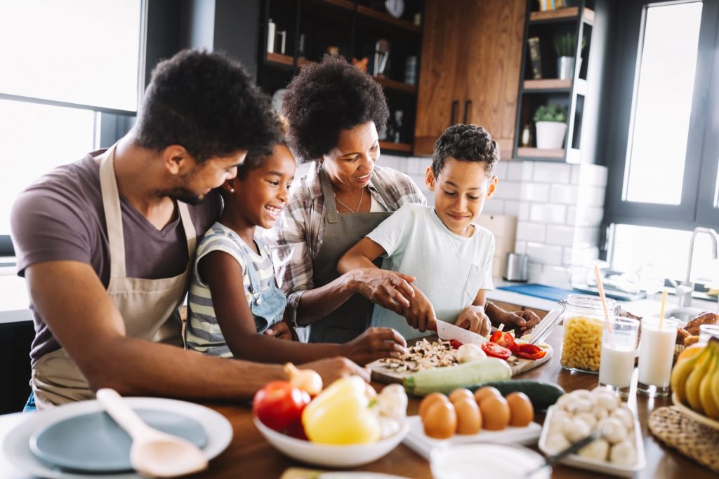 Happy family cooking together.